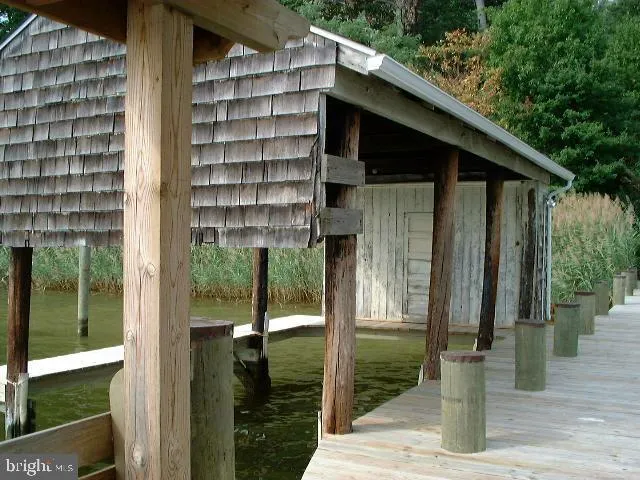 a view of terrace with seating space and lake view