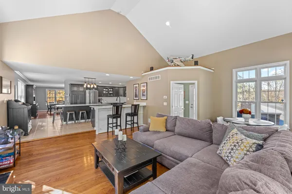 a living room with furniture and a table