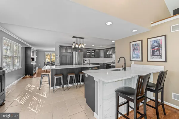 a large kitchen with a table and chairs