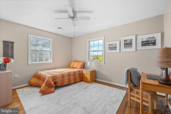 a bedroom with furniture and a window