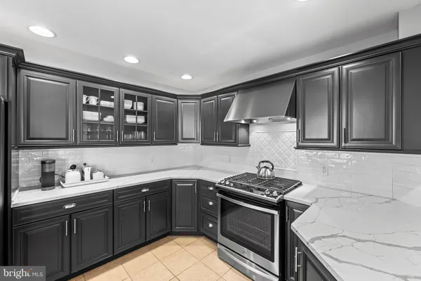 a kitchen with a sink stove and microwave