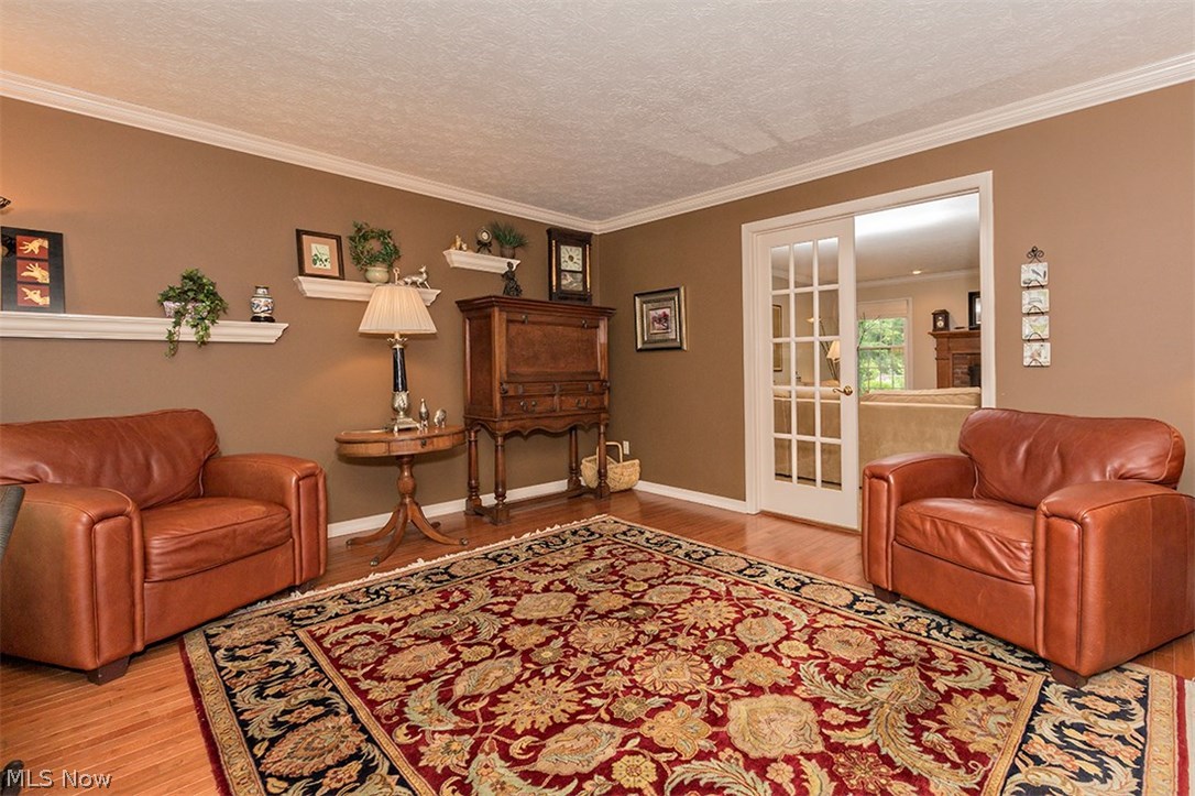 6575 Liberty Road Solon, OH 44139 - Photo 10 of 30 Double glass paned doors separate the living and family room