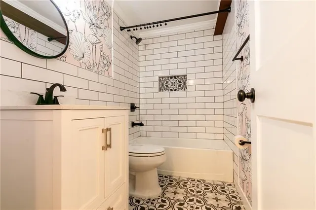 a bathroom with a toilet and a shower curtain
