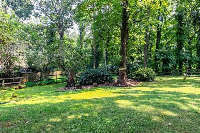 a view of a swimming pool with a big yard