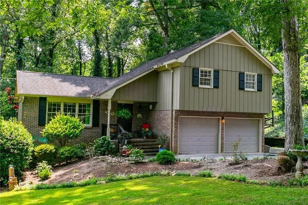 a front view of a house with garden