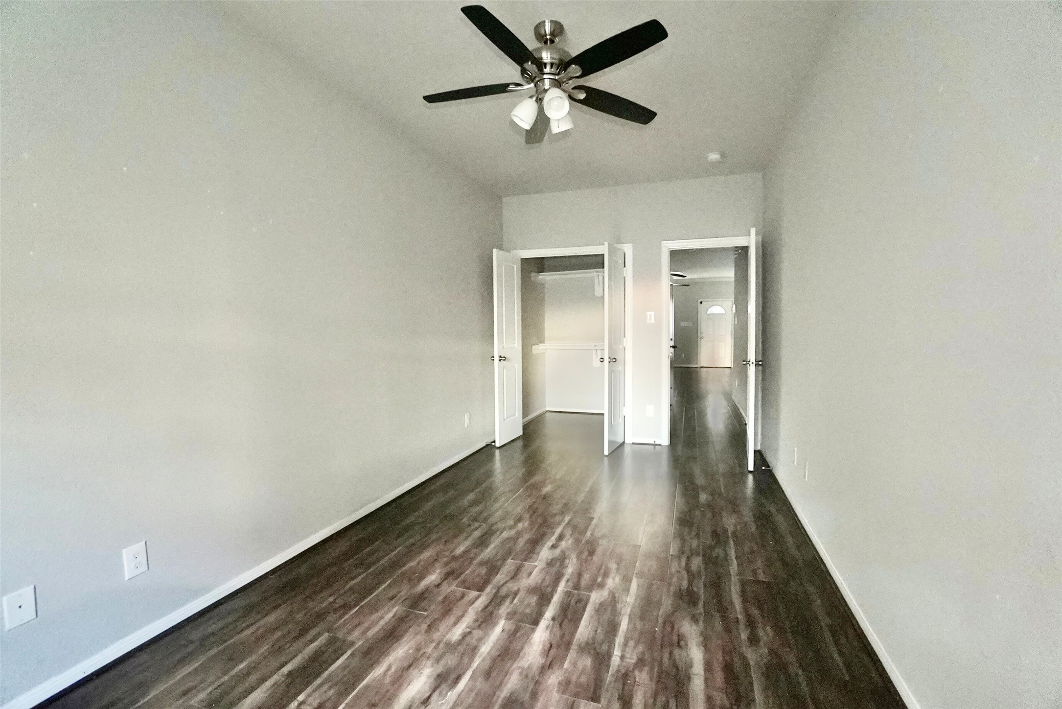 2523 Kirk Street, Unit B Houston, TX 77026 - Photo 10 of 16 a view of a room with wooden floor and a ceiling fan