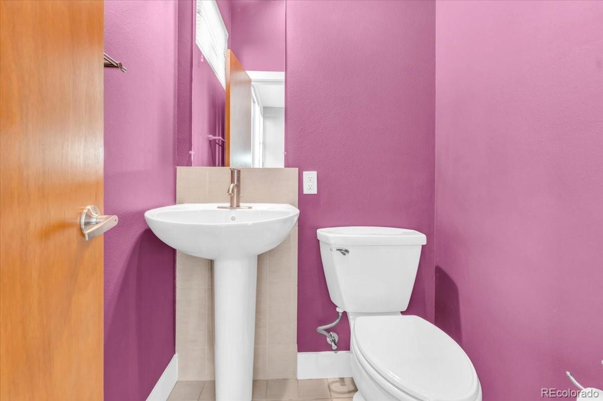 2900 Inca Street, Unit 15 Denver, CO 80202 - Photo 20 of 40 a white toilet sitting next to a bathroom sink