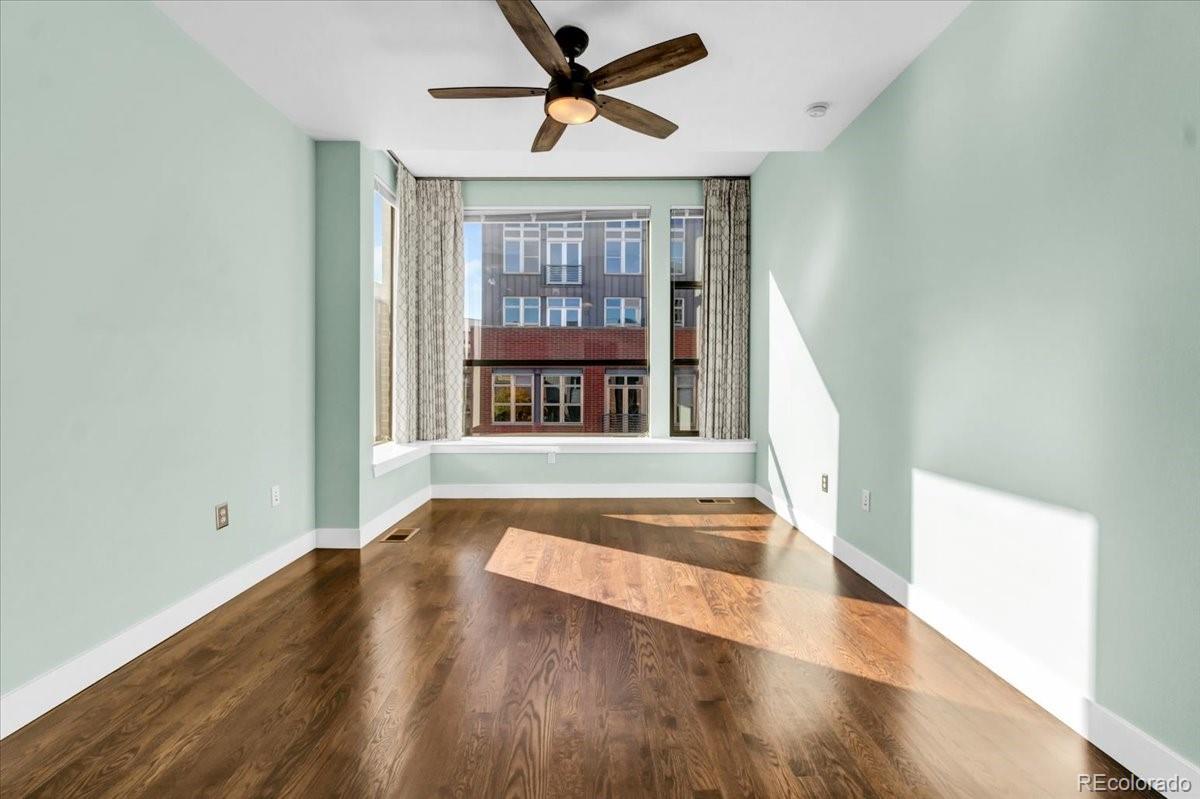 2900 Inca Street, Unit 15 Denver, CO 80202 - Photo 23 of 40 wooden floor in an empty room with a window