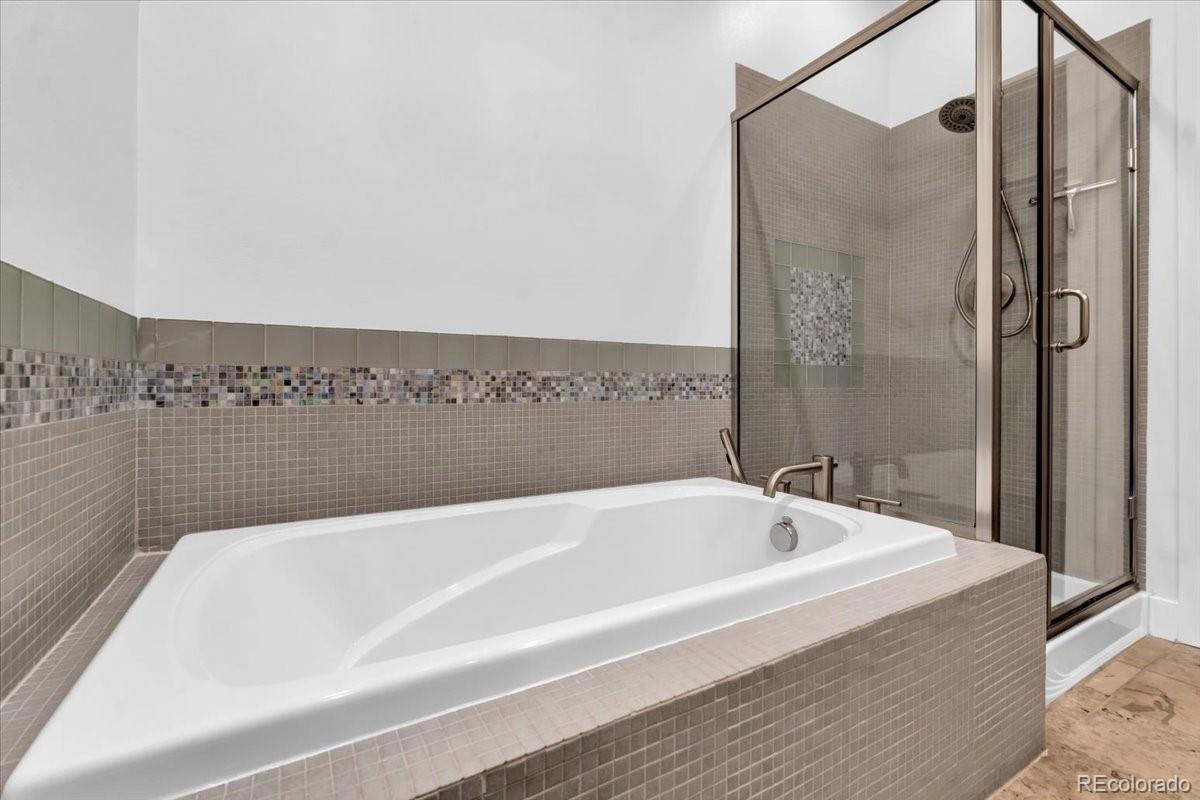 2900 Inca Street, Unit 15 Denver, CO 80202 - Photo 26 of 40 a bathroom with bathtub and shower