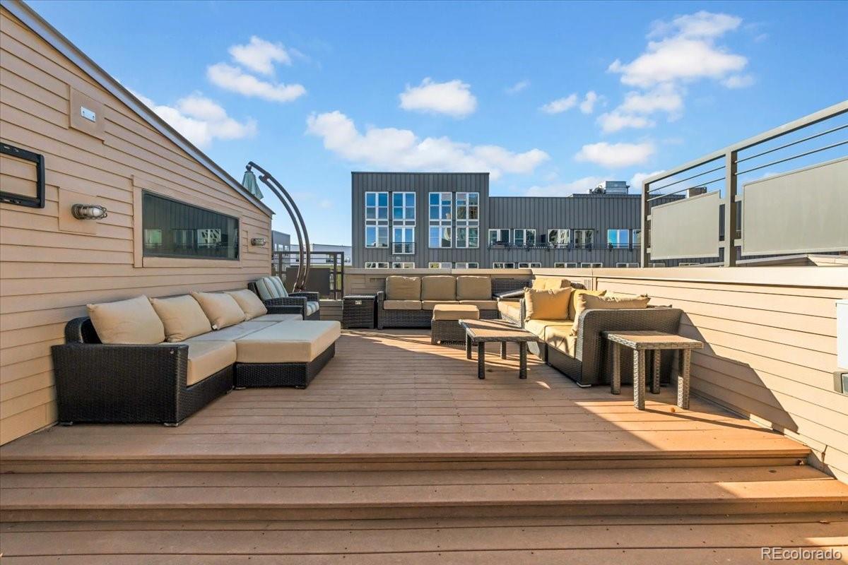 2900 Inca Street, Unit 15 Denver, CO 80202 - Photo 32 of 40 a balcony with furniture and outdoor seating