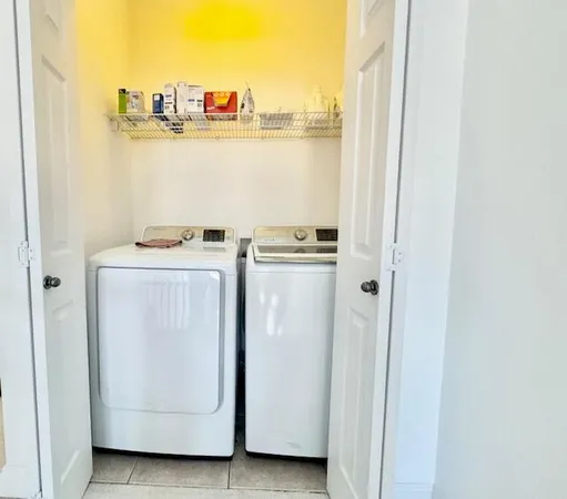 a utility room with dryer and washer