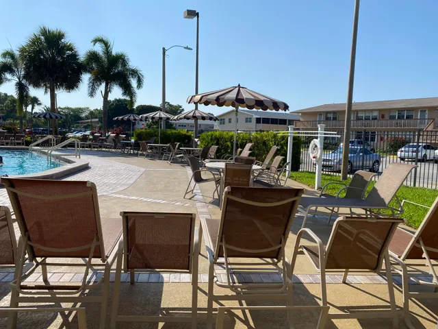 a view of an chairs and tables in the patio