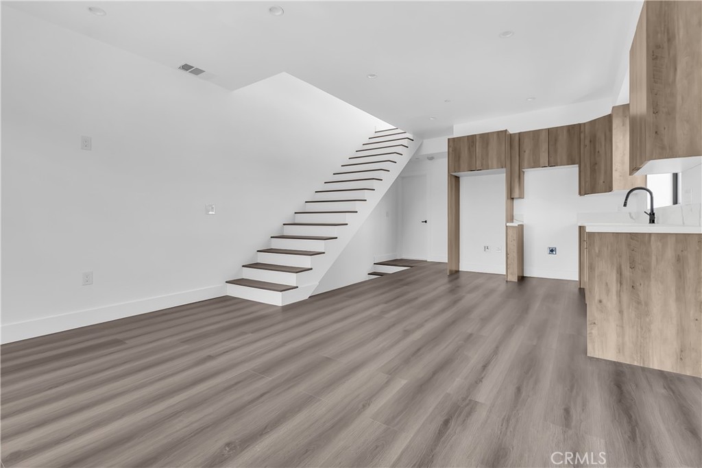 1571 Ricardo Street Los Angeles, CA 90033 - Photo 14 of 19 a view of a room with wooden floors and stairs