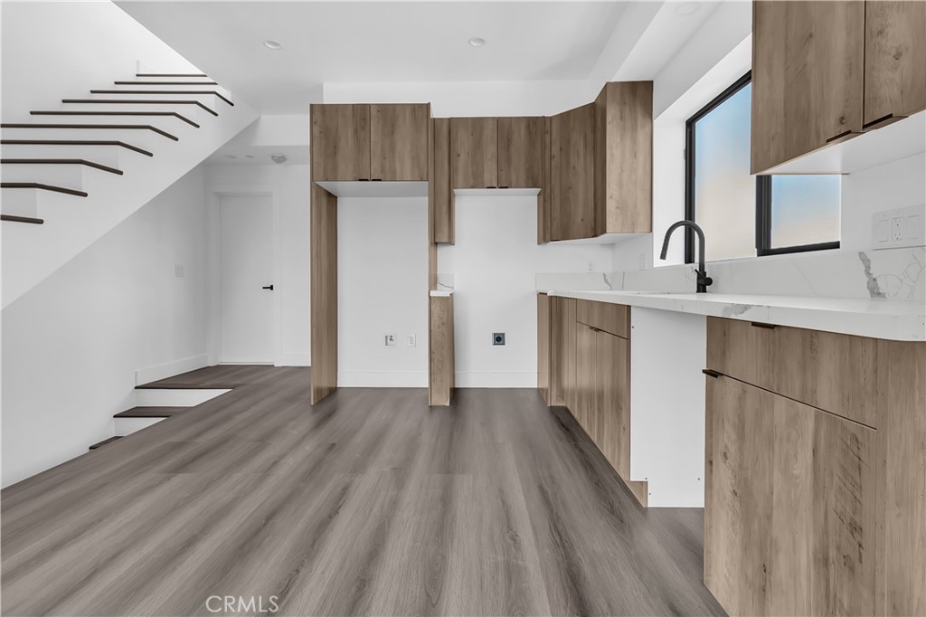 1571 Ricardo Street Los Angeles, CA 90033 - Photo 16 of 19 a view of a kitchen with wooden floor and electronic appliances