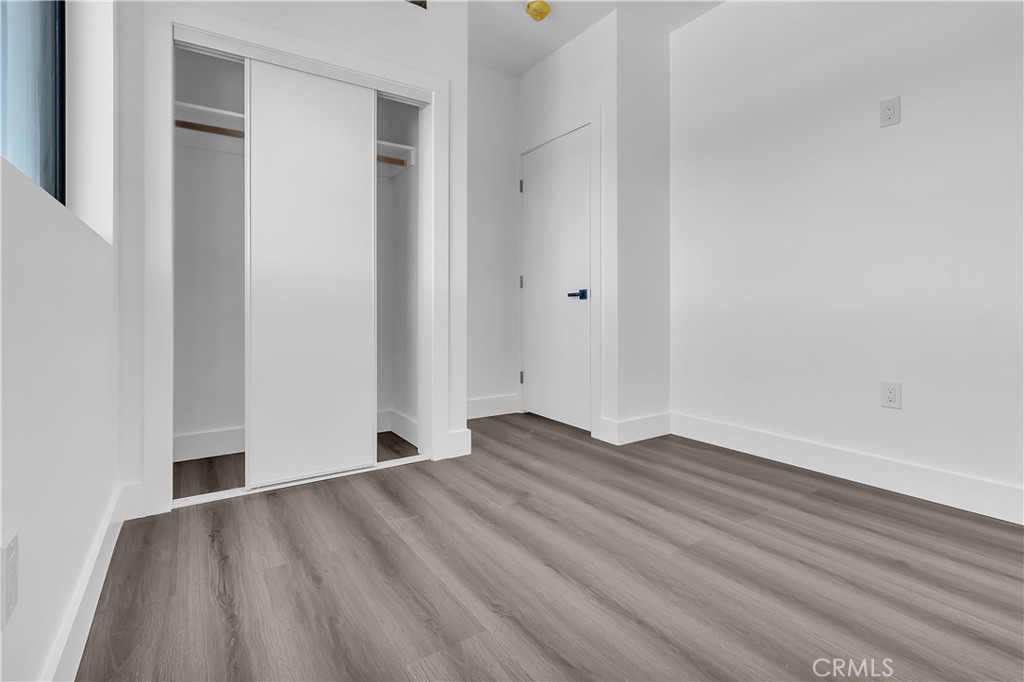 1571 Ricardo Street Los Angeles, CA 90033 - Photo 18 of 19 a view of an empty room with wooden floor