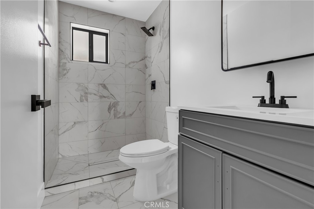 1571 Ricardo Street Los Angeles, CA 90033 - Photo 19 of 19 a bathroom with a sink a toilet and shower