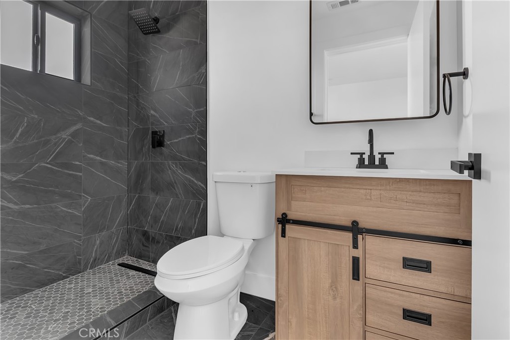 1571 Ricardo Street Los Angeles, CA 90033 - Photo 3 of 19 a bathroom with a sink toilet and shower