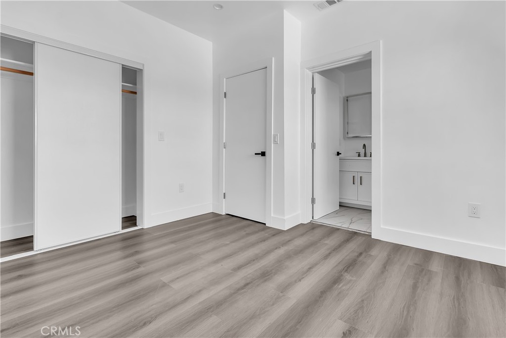 1571 Ricardo Street Los Angeles, CA 90033 - Photo 8 of 19 a view of an empty room with wooden floor and closet