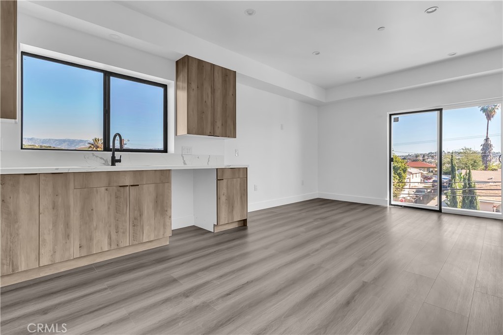 1571 Ricardo Street Los Angeles, CA 90033 - Photo 10 of 19 a view of an empty room with wooden floor and a window