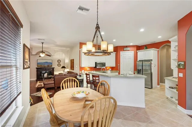 a view of a dining room with furniture window and outside view