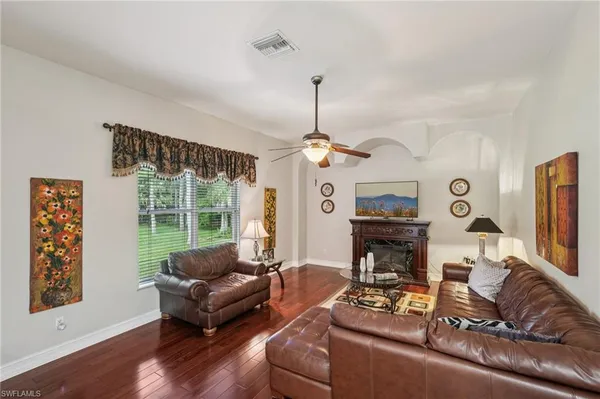 a kitchen with stainless steel appliances kitchen island granite countertop a sink and cabinets