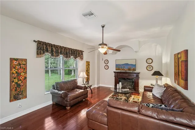 a kitchen with stainless steel appliances kitchen island granite countertop a sink and cabinets