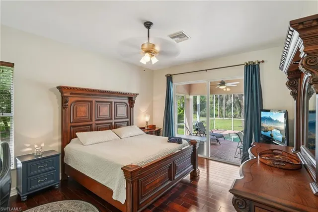 a very nice looking dining room with a large window and chandelier