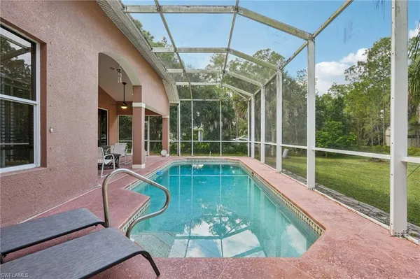 a view of a swimming pool with a porch