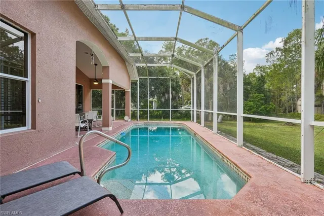 a view of a swimming pool with a porch