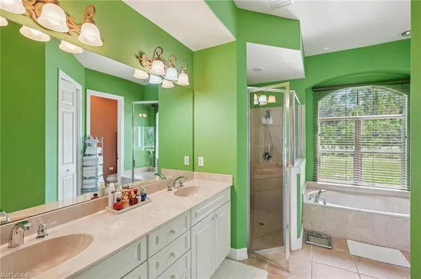 a bedroom with a bed and wooden floors