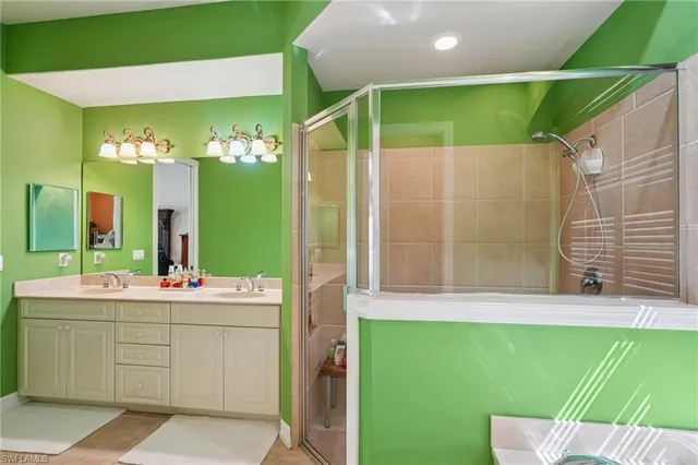 a bathroom with a bathtub and a shower