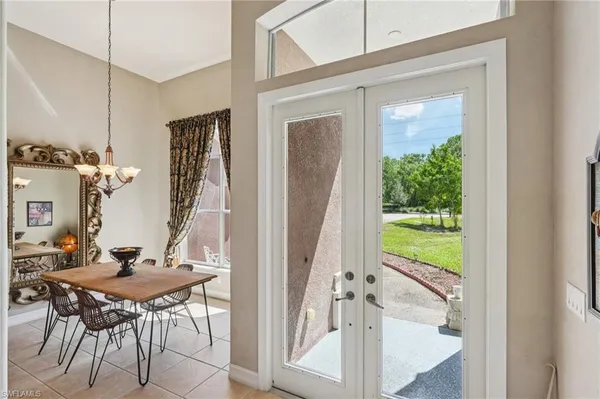 a view of a dining room with furniture window and outside view