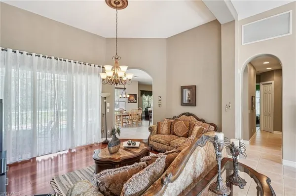 a view of a workspace with furniture and a table