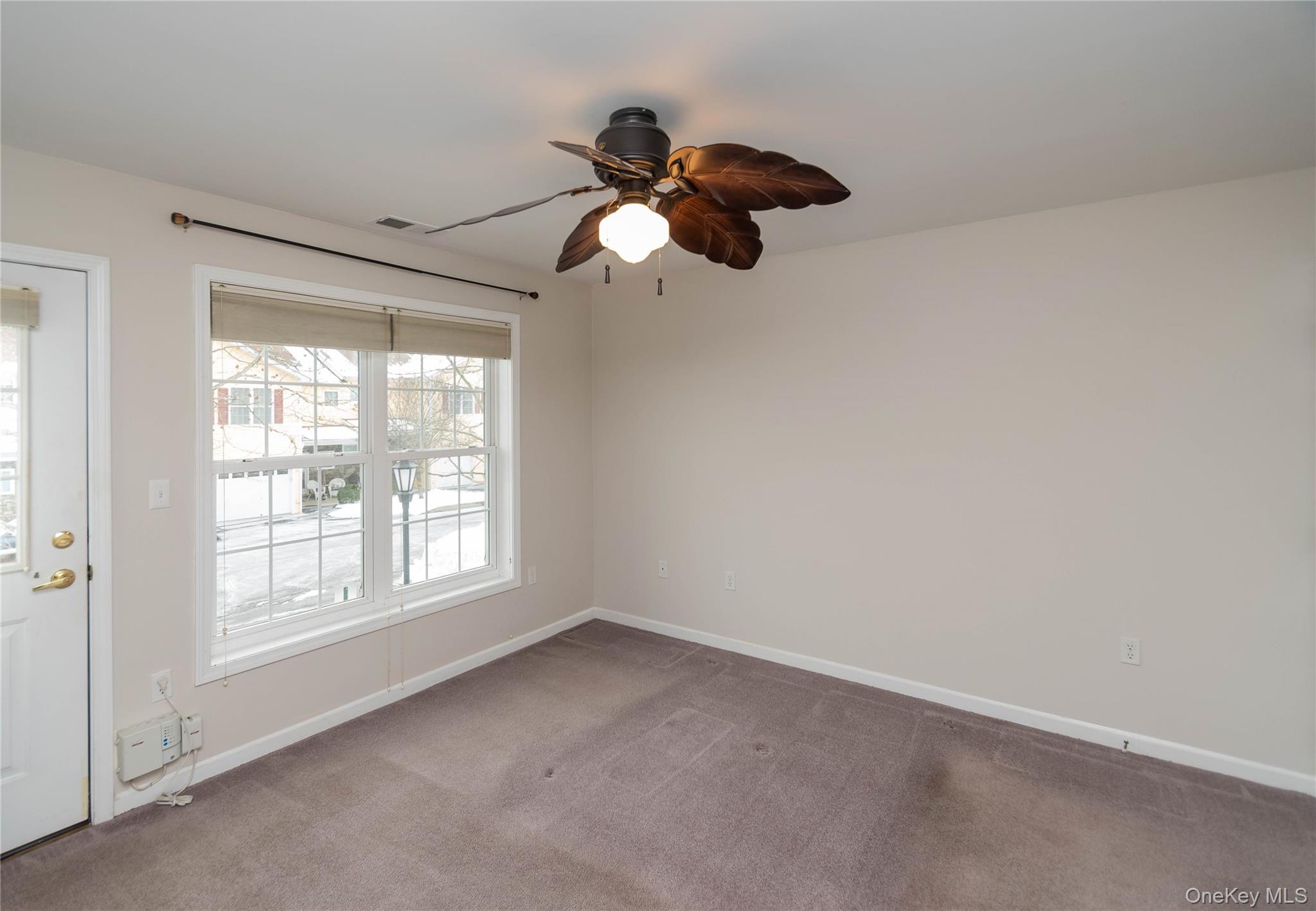 70 Aveonis Court Fishkill, NY 12524 - Photo 9 of 19 Empty room featuring light colored carpet and a ceiling fan