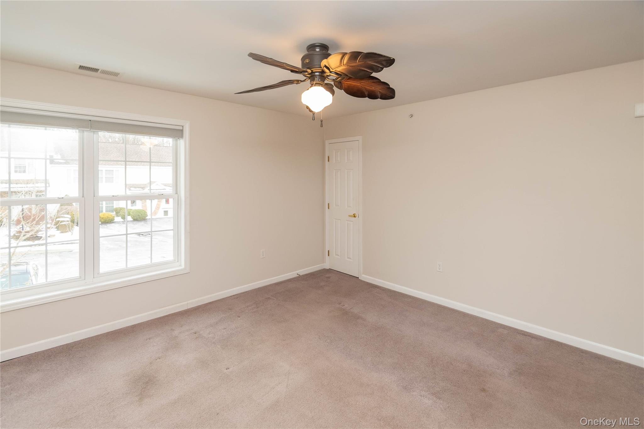 70 Aveonis Court Fishkill, NY 12524 - Photo 7 of 19 Empty room featuring light colored carpet and ceiling fan