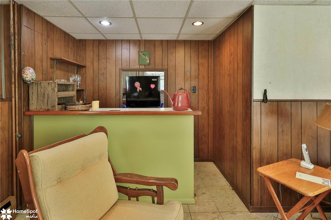 6054 Old Hickory Road Coopersburg, PA 18036 - Photo 25 of 48 Rich wood paneling and a dedicated bar area bring classic warmth to this versatile space.