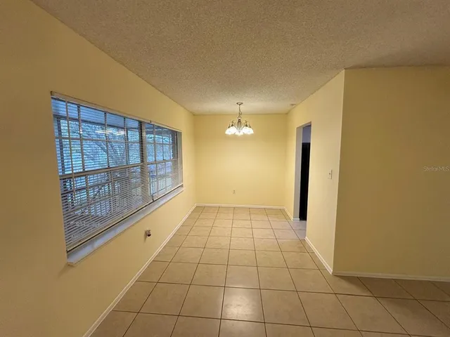a kitchen with a sink a refrigerator and washer