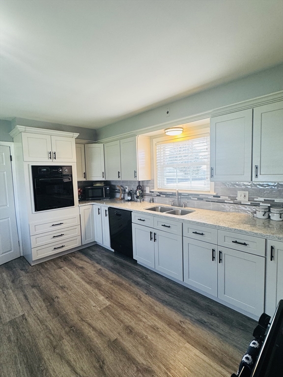 649 Stafford Road Fall River, MA 02721 - Photo 11 of 17 a large kitchen with stainless steel appliances granite countertop a stove a sink and a microwave
