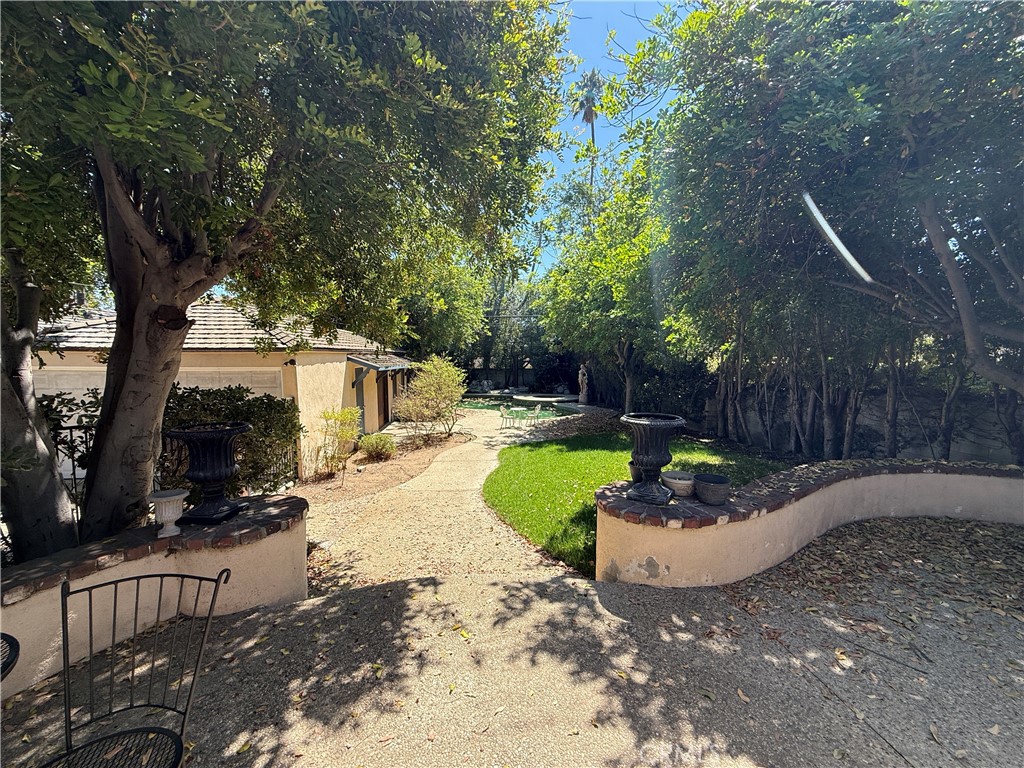 2510 Lorain Road San Marino, CA 91108 - Photo 15 of 17 a view of a backyard with plants and a slide