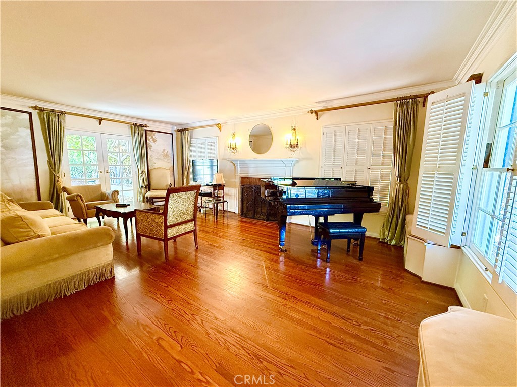 2510 Lorain Road San Marino, CA 91108 - Photo 2 of 17 a living room with fireplace furniture and a large window
