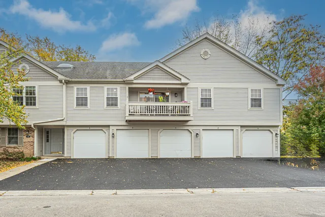 a front view of a house with a garage