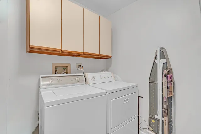 a view of a chairs and table in the balcony
