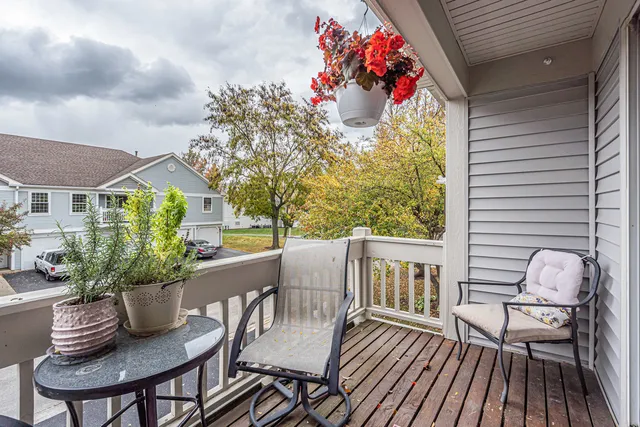 a dining room with furniture a rug and a chandelier