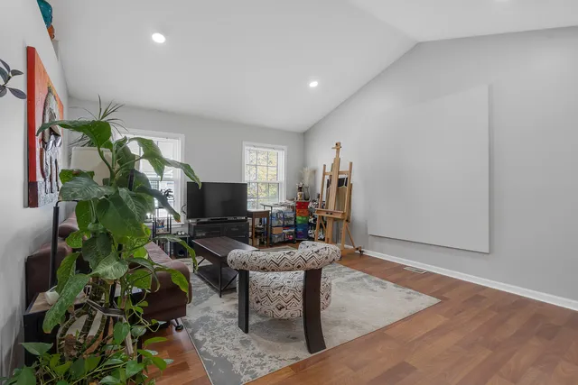 a workspace with furniture and a potted plant