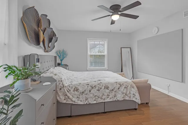a bathroom with a granite countertop sink a toilet and a mirror