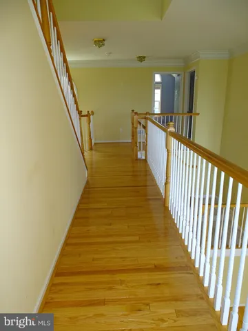 a view of a balcony with wooden floor