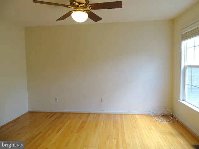 a view of a room with a window and closet