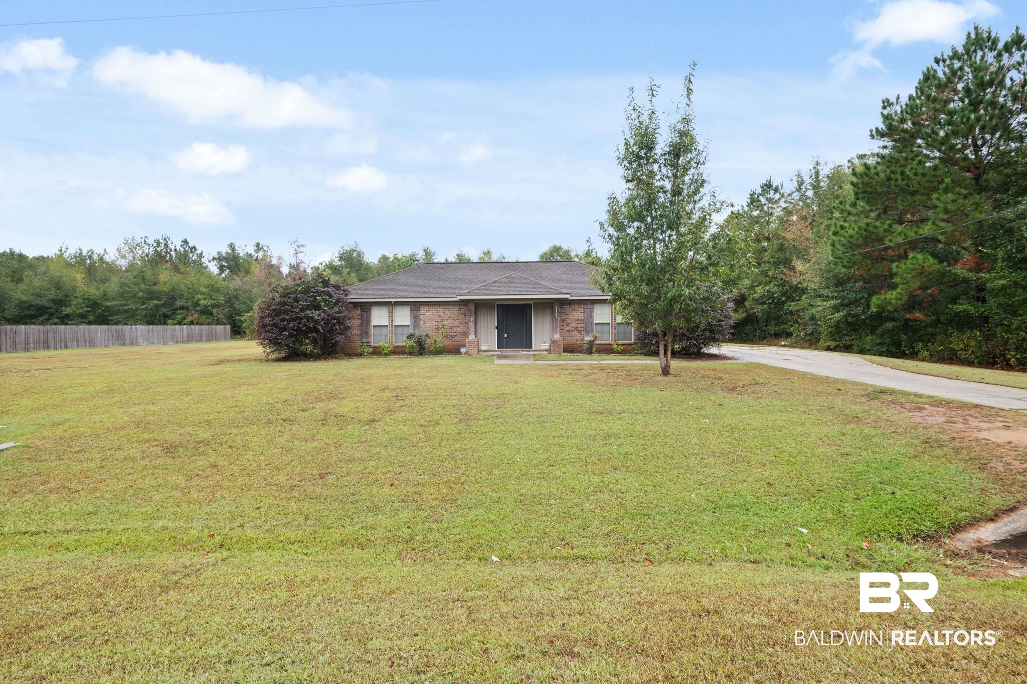 1363 Creola Axis Loop Road North Axis, AL 36505 - Photo 1 of 1 Ranch-style home with a front yard