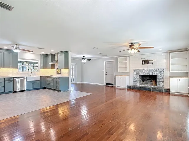 a kitchen with stainless steel appliances a sink and a refrigerator