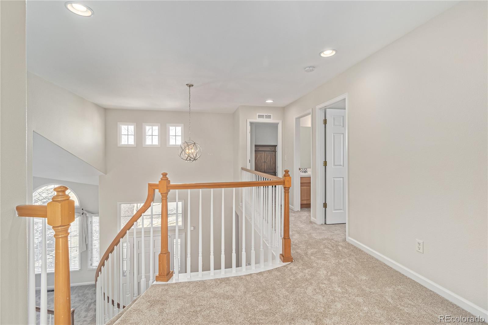 10152 Knoll Circle Highlands Ranch, CO 80130 - Photo 12 of 34 a view of a hallway view with staircase